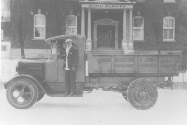 A truck and its driver in front of the St-Joseph Hospital, 1939. MUHC Permanent Archives Centre, 2014-0018.04.57. 