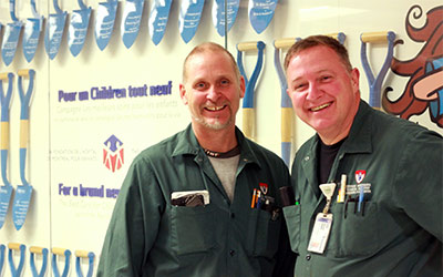 Carpenters Greg Beerwort (left) and Sylvain Parent maintain the original building of the Montreal Children’s Hospital of the MUHC.