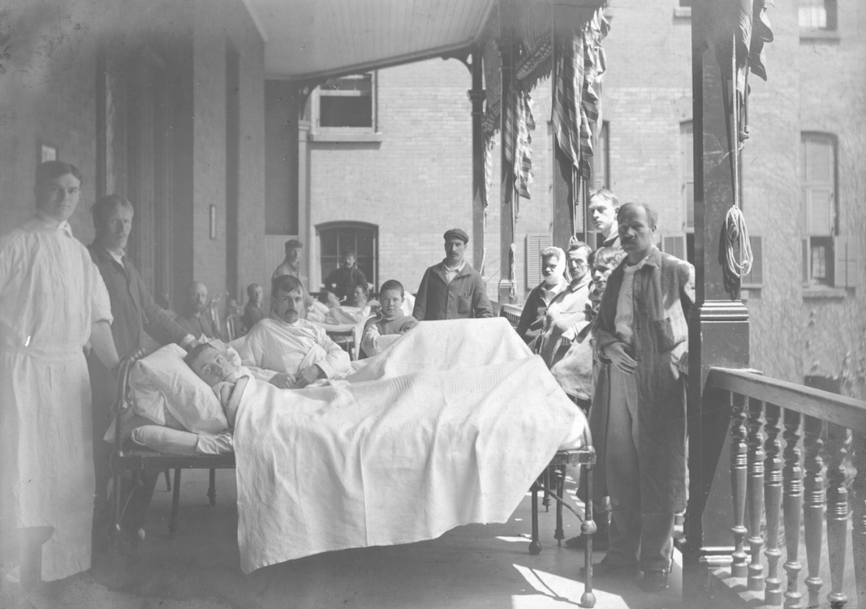 Patients, staff and visitors on the Ward M balcony