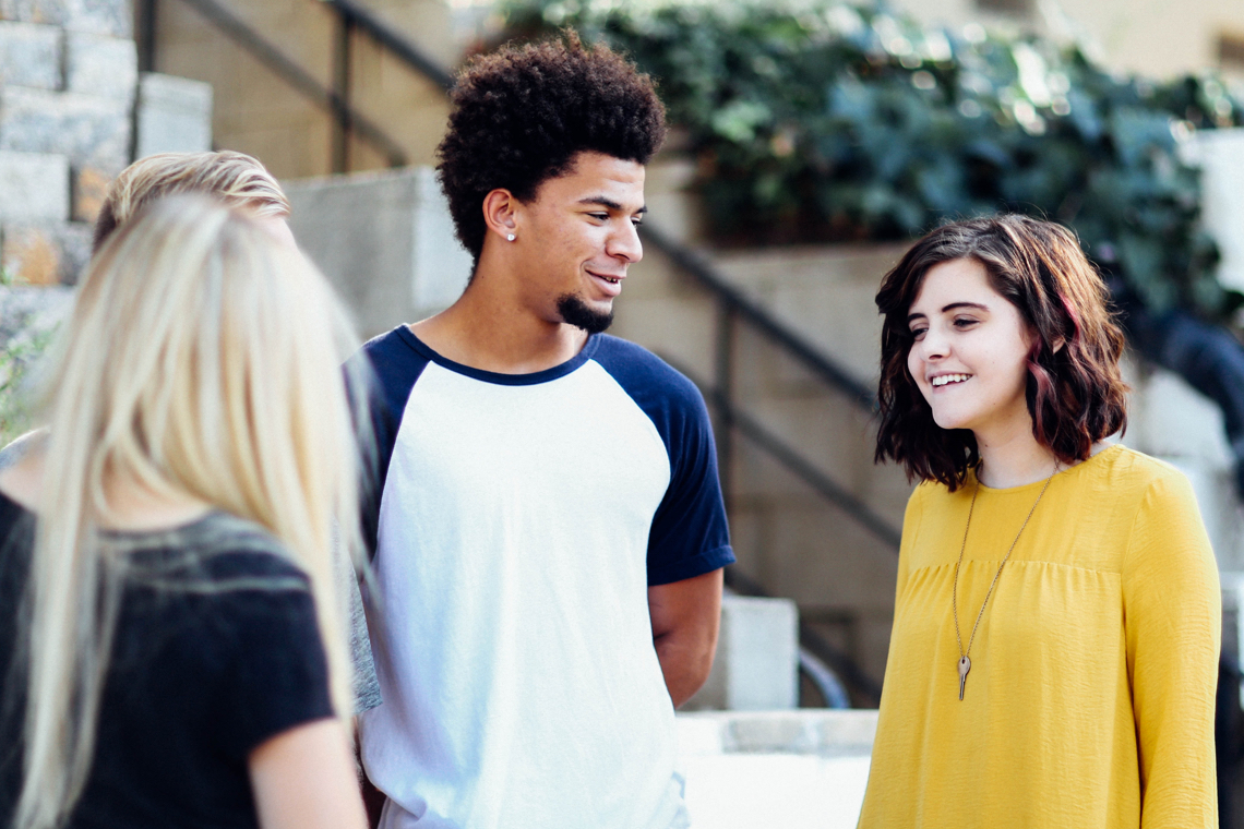 Four young person discussing