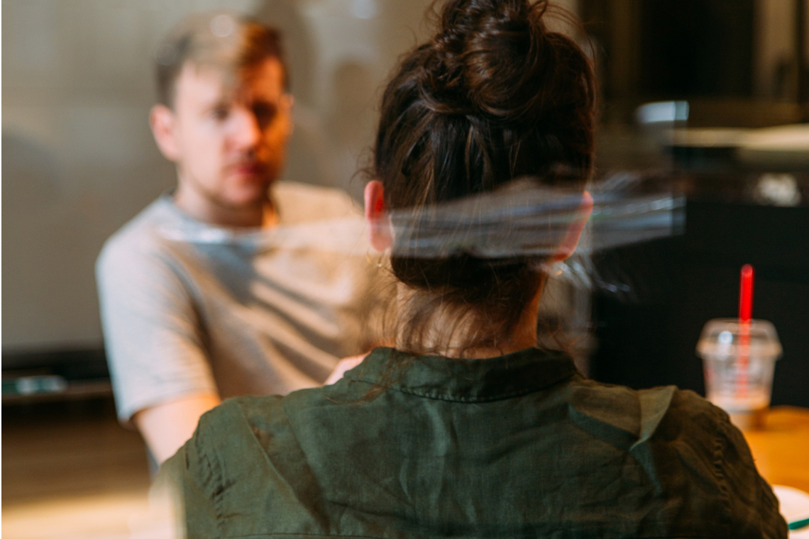 Young man and woman discussing